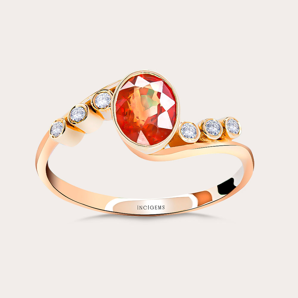 Kenarlarında pırlanta taşları ve ortasında oval kesim yakut taşı bulunan vintage tasarım yüzük